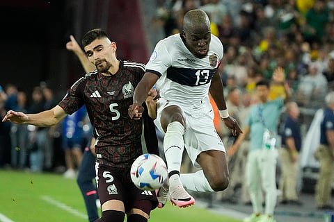 Enner Valencia and Johan Vasquez battle for the ball